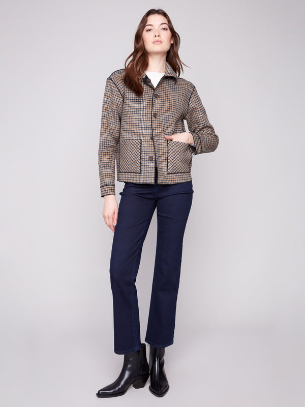 Reversible plaid jacket showcasing its versatile design for multiple styling options by Charlie B.