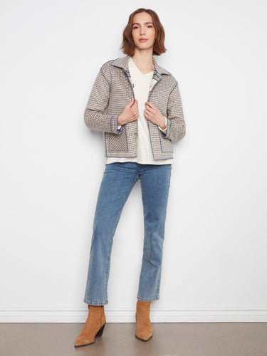 Fashionable checkered pattern enhances the reversible design of this cozy jacket. By Charlie B.