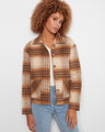 Plaid jacket with a classic shirt collar and button-front closure, perfect for layering. By Charlie B.