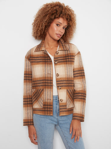 Plaid jacket with a classic shirt collar and button-front closure, perfect for layering. By Charlie B.