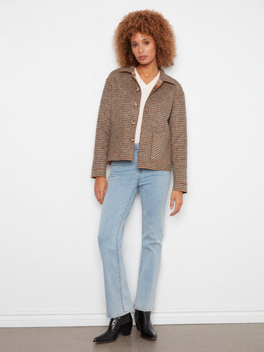 Checkered jacket with convenient patch pockets, adding practicality to the chic style. By Charlie B.
