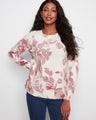 Floral sweater with a crew neckline and long raglan sleeves, offering a cozy fit by Charlie B.
