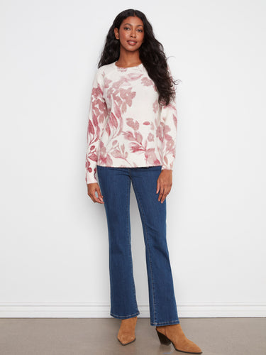 Elegant floral pattern on this cozy sweater, complete with crew neckline and raglan sleeves by Charlie B.