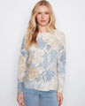 Reversible sweater with a crew neckline showcasing abstract floral prints in soft tones, featuring long raglan sleeves by Charlie B.