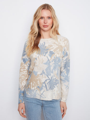 Reversible sweater with a crew neckline showcasing abstract floral prints in soft tones, featuring long raglan sleeves by Charlie B.