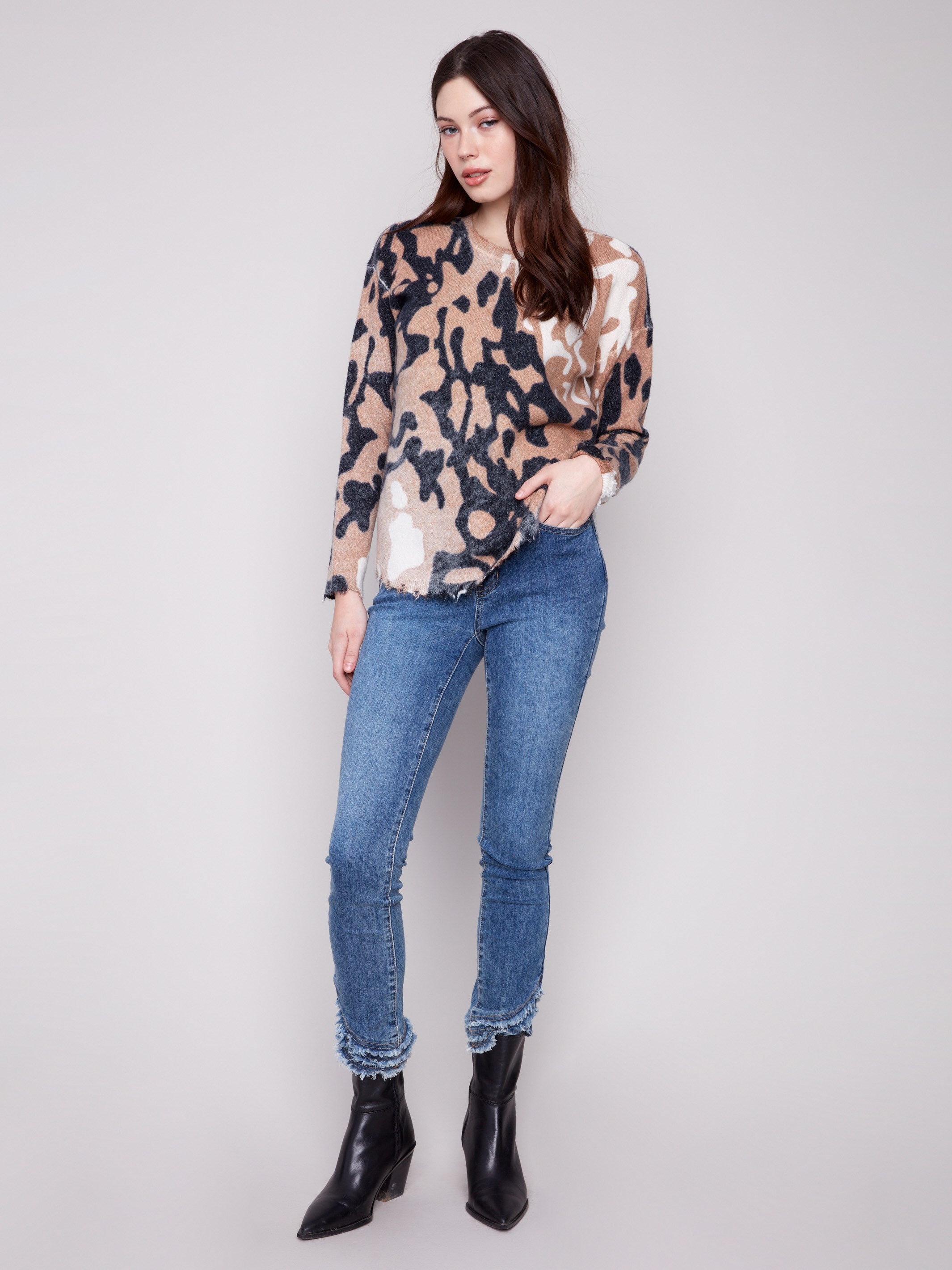 Drop shoulders add a relaxed fit to this brown and black spotted plush sweater by Charlie B.