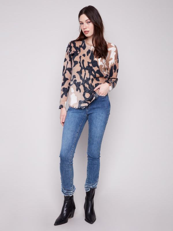 Drop shoulders add a relaxed fit to this brown and black spotted plush sweater by Charlie B.