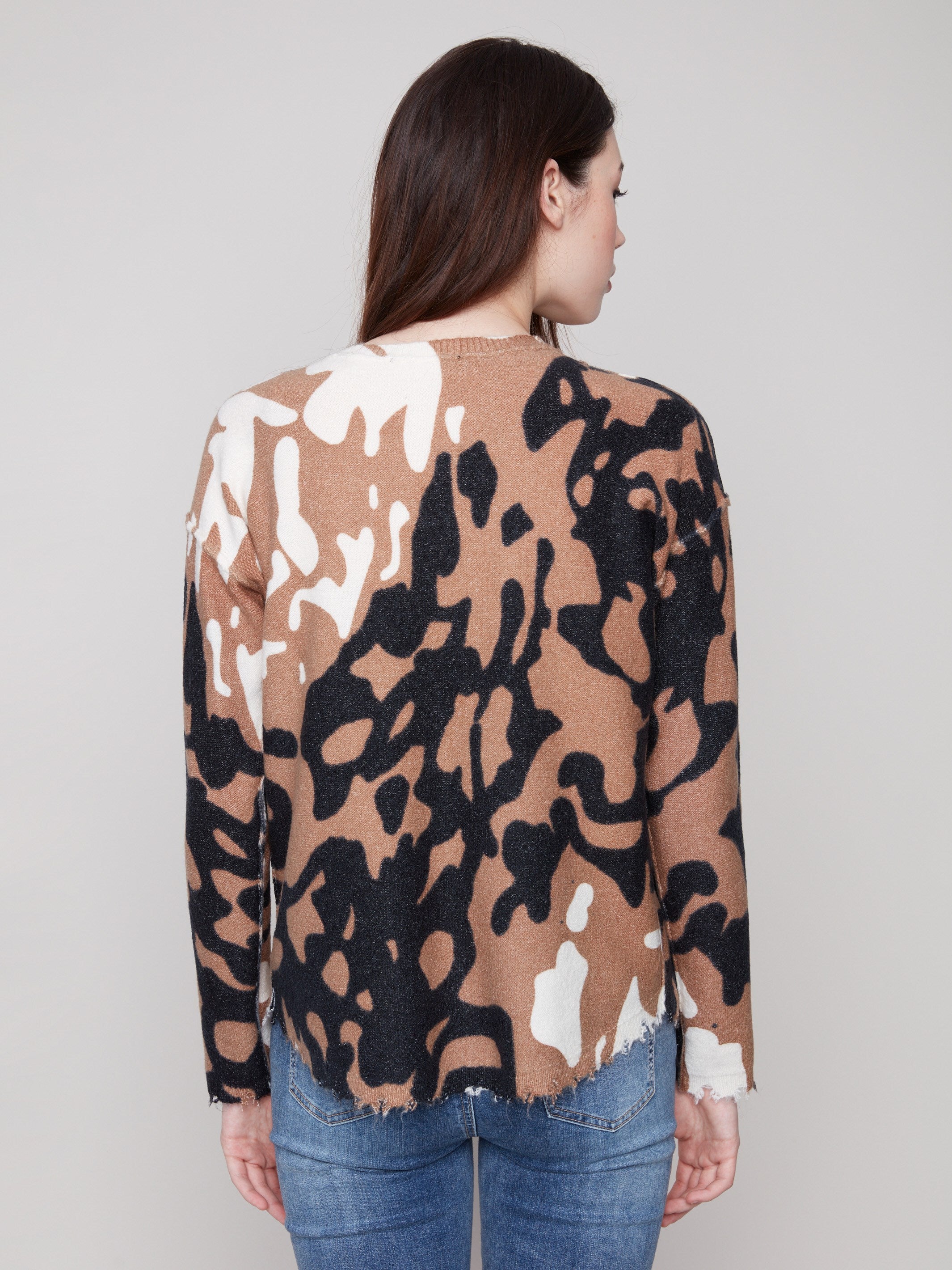 The frayed edges enhance the casual look of this brown and black spotted plush sweater by Charlie B.
