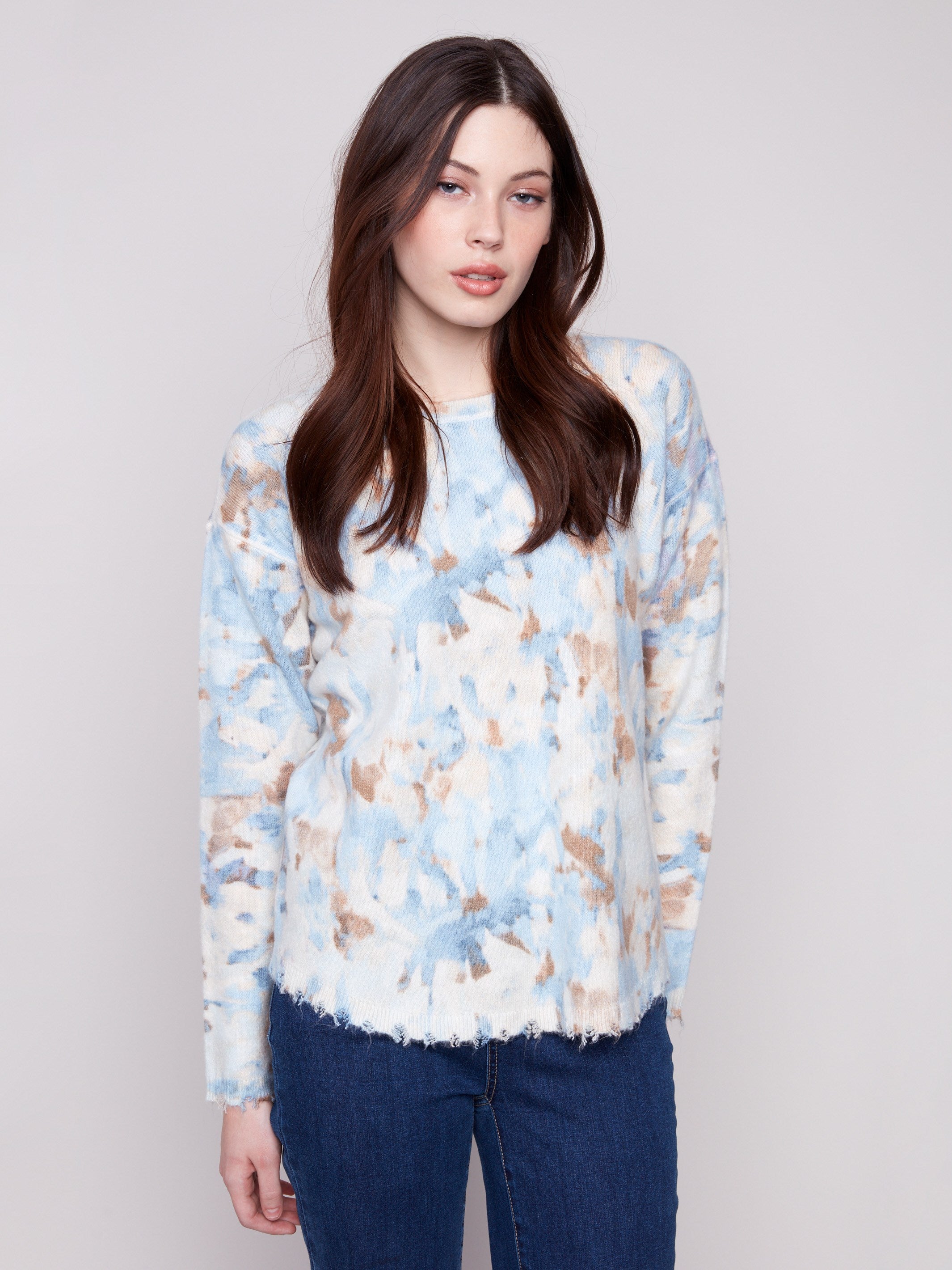 Abstract printed plush sweater featuring a crew neckline and frayed edges, offering a casual yet chic look by Charlie B.