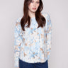Abstract printed plush sweater featuring a crew neckline and frayed edges, offering a casual yet chic look by Charlie B.
