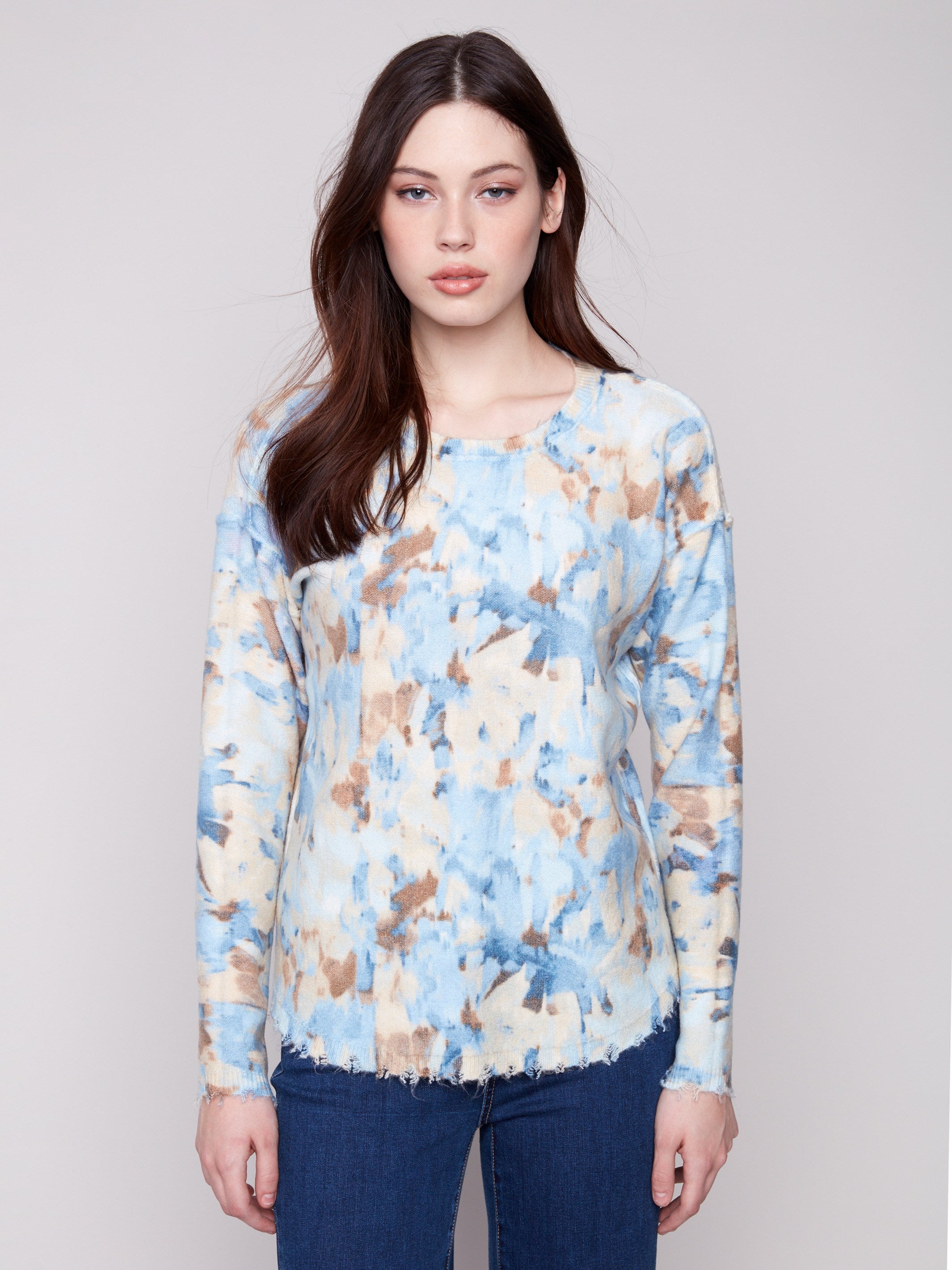 Experience comfort with the plush texture of this vapor-colored sweater, enhanced by its unique abstract print by Charlie B.