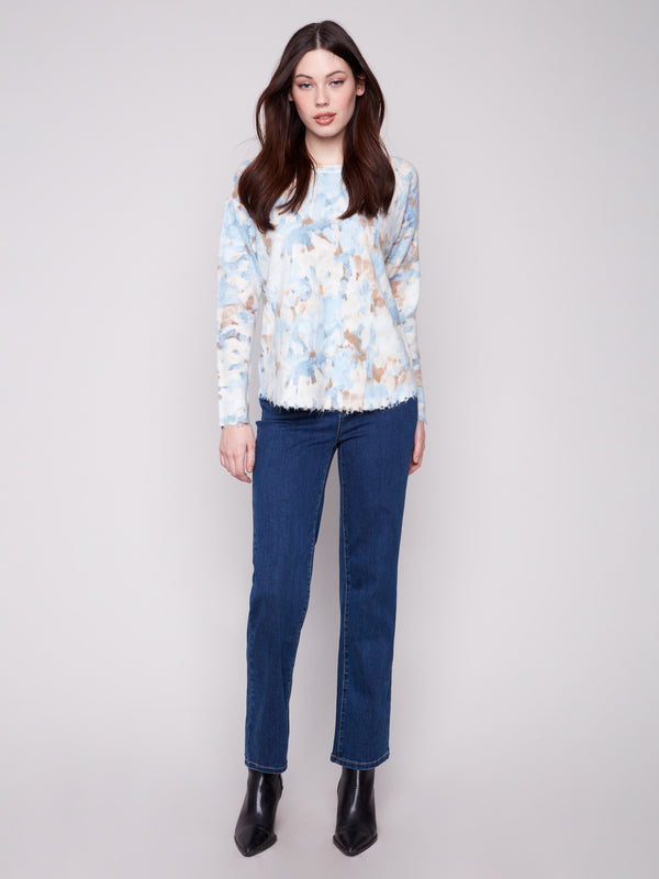 Enjoy the cozy feel of this plush sweater with its stylish abstract pattern and comfortable fit by Charlie B.