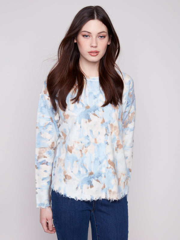 Abstract printed sweater with drop shoulders and crew neckline, perfect for layering or wearing on its own by Charlie B.