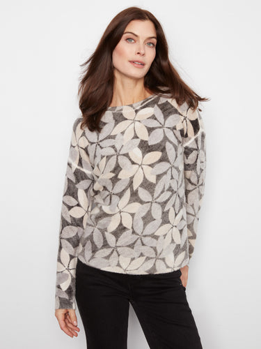 Soft sweater featuring dreamy floral patterns in pastel shades, designed with drop shoulders by Charlie B.