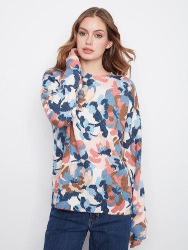 Experience versatility with this reversible floral sweater, perfect for switching up your look effortlessly. By Charlie B.