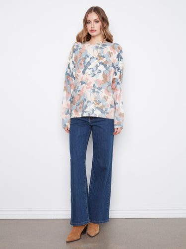 Designed with drop shoulders, this floral sweater provides a relaxed and trendy silhouette for everyday wear. By Charlie B.