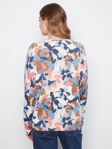 Long sleeves provide warmth while maintaining the chic style of this beautifully patterned sweater. By Charlie B.