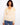 Charming sweater with a flattering V-neck, showcasing a cheerful floral pattern in soft hues. Perfect for casual outings. By Charlie B.