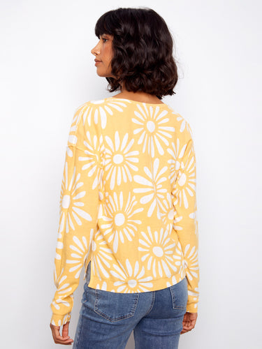 Elevate your look with this beautiful V-neck top in breathable cotton, designed to keep you comfortable and stylish all season long. By Charlie B.