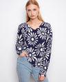 Sunkiss and white reversible sweater with long sleeves, showcasing a bold floral print for versatile styling by Charlie B.