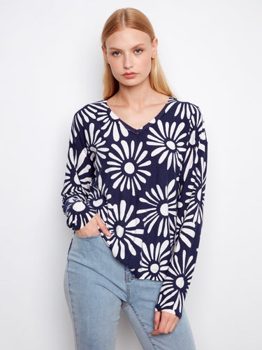 Sunkiss and white reversible sweater with long sleeves, showcasing a bold floral print for versatile styling by Charlie B.