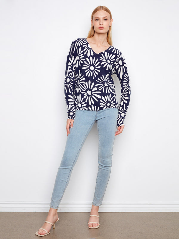 Chic navy blue and white sweater crafted from soft cotton, complete with a v-neckline and stylish design by Charlie B.
