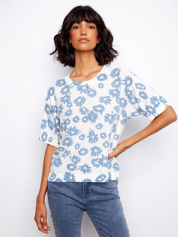 Embrace effortless style with this reversible design floral blouse. A versatile addition to your collection by Charlie B.
