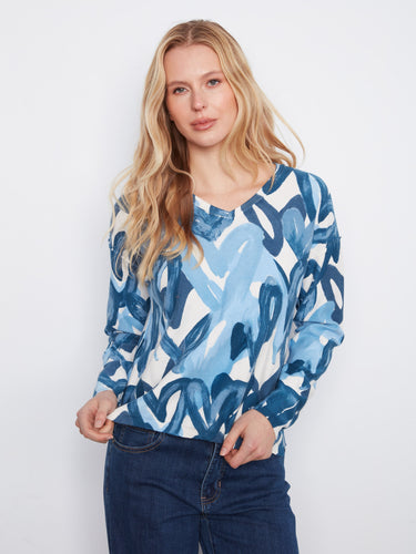 The reversible print adds versatility to this long-sleeve top, making it perfect for any occasion. By Charlie B.