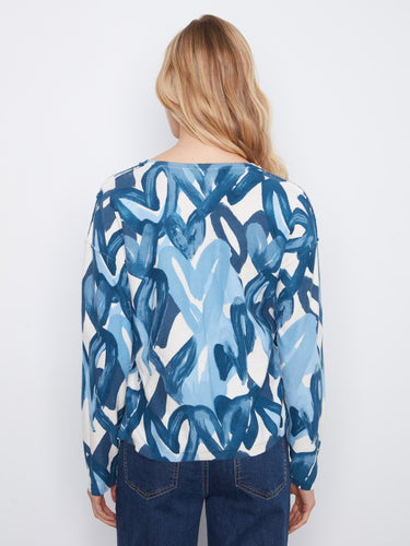 With its unique design and quality fabric, this piece is perfect for layering or wearing alone. By Charlie B.