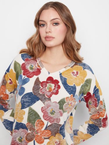 Crafted from a durable cotton blend, this vibrant floral sweater is ideal for layering during cooler seasons by Charlie B.