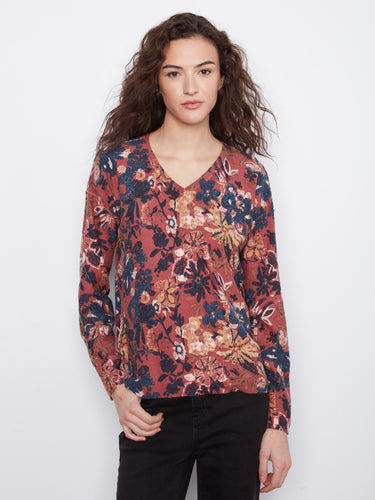 Floral V-neck top with a reversible print, showcasing vibrant colors and a relaxed fit. By Charlie B.