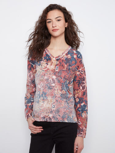 Cotton blend top with drop shoulders, offering a comfortable yet stylish look for any occasion. By Charlie B.