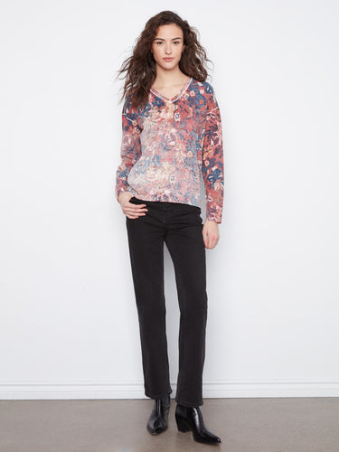 Versatile reversible design with contrasting prints, providing two looks in one garment. By Charlie B.