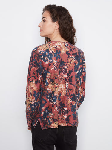 Chic V-neckline enhances the feminine silhouette of this floral patterned top. Perfect for casual outings. By Charlie B.