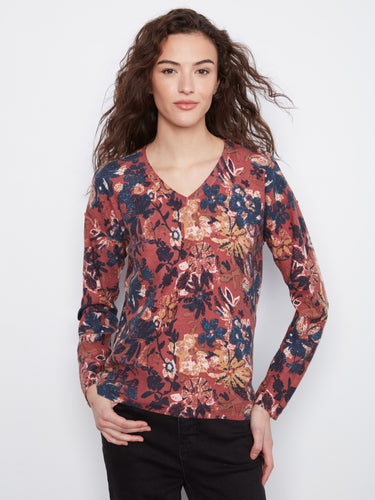 Soft cotton blend fabric ensures comfort while maintaining an elegant floral aesthetic in this top. By Charlie B.