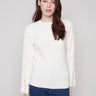 Ecru ribbed sweater showcasing a classic crew neck style, perfect for layering or wearing alone by Charlie B.