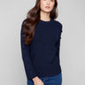 Navy sweater featuring a classic crew neck design, perfect for layering in any season. The ribbed knit adds texture and style by Charlie B.