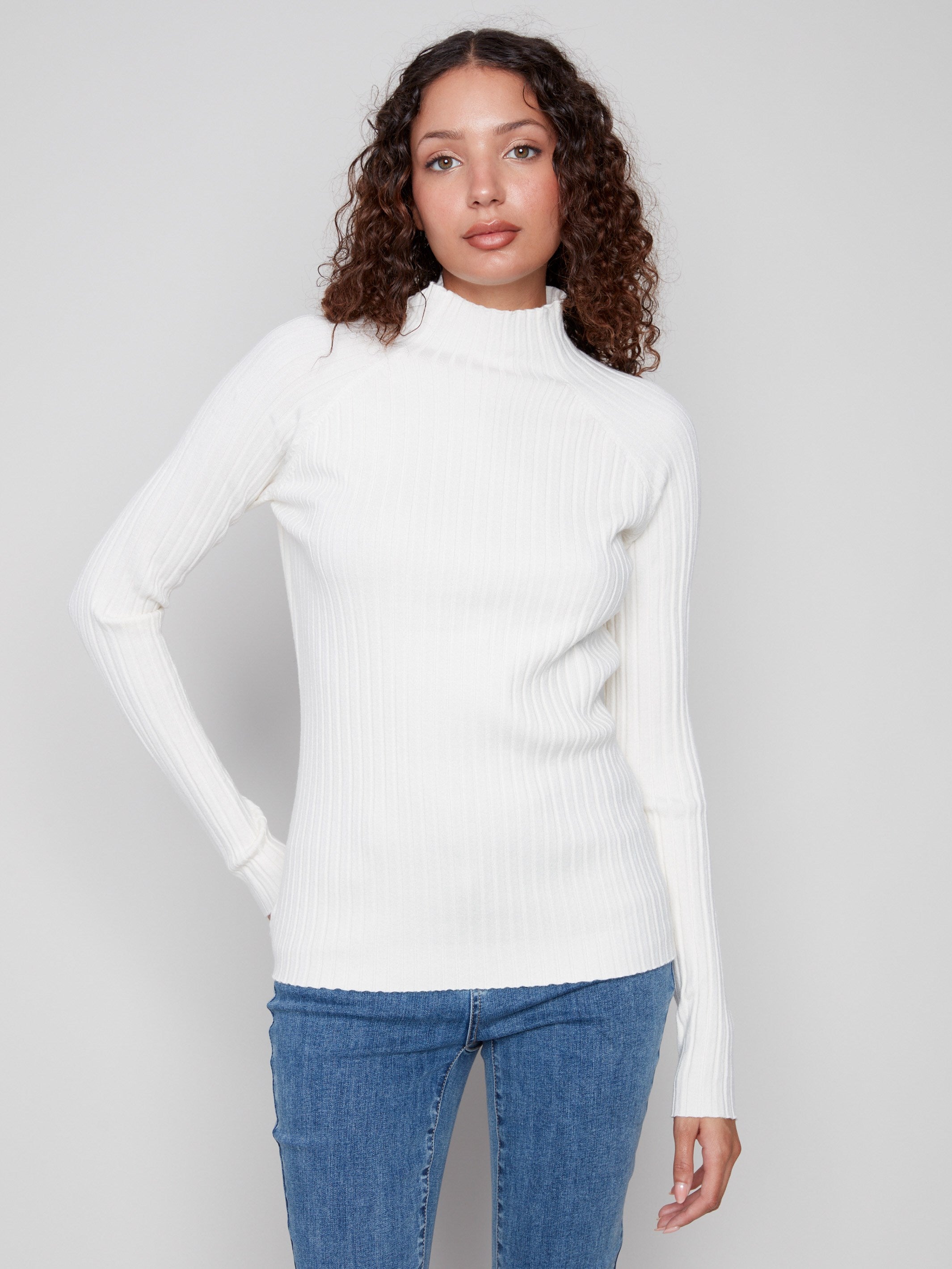 Ecru sweater with a slim fit design, featuring a cozy mock neck for added warmth by Charlie B.
