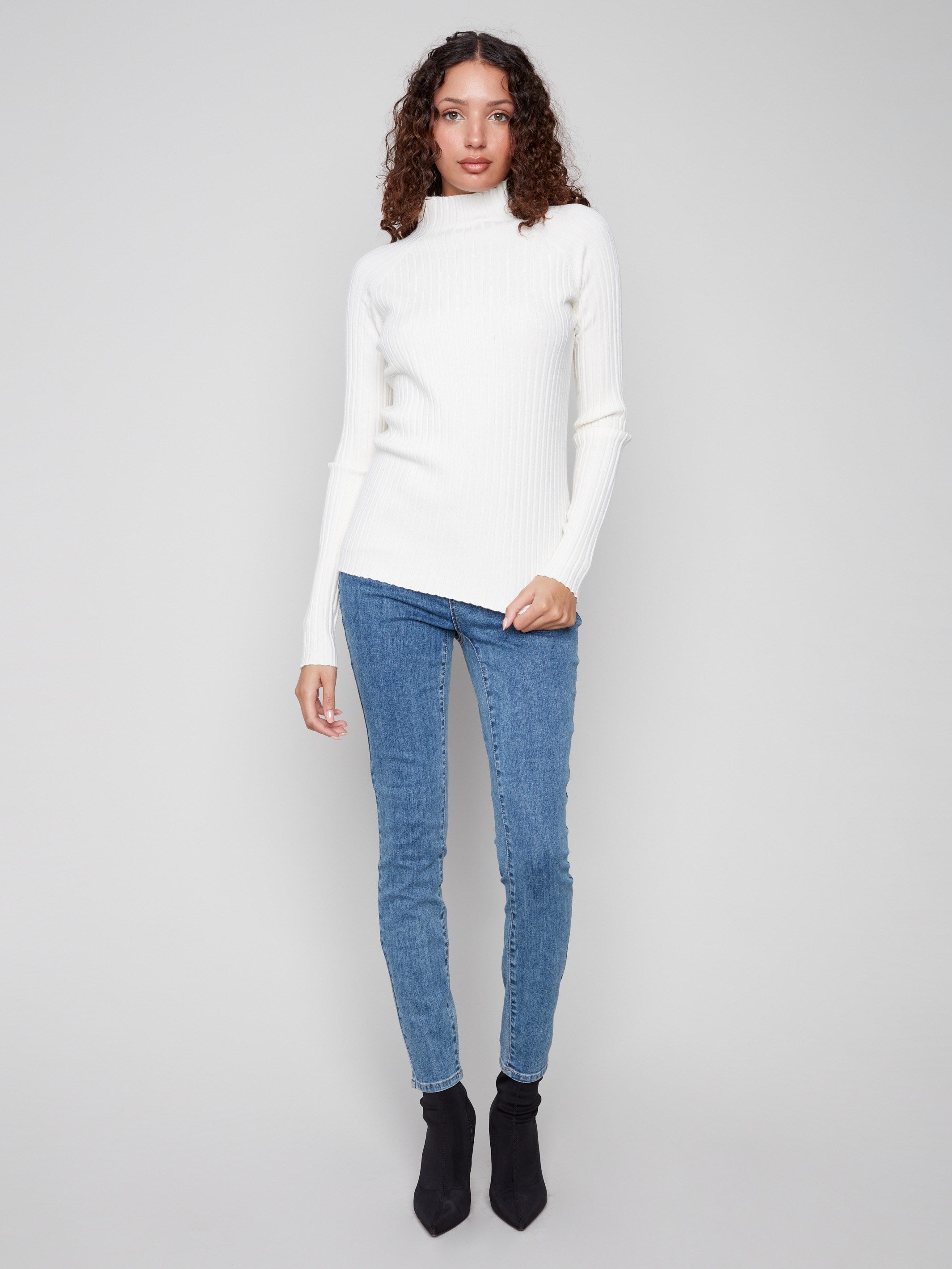 Ribbed knit texture enhances the ecru sweater's stylish appearance by Charlie B.