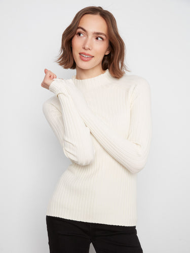 This slim fit sweater features long sleeves and a refined design, ideal for any occasion. Elevate your wardrobe by Charlie B.