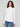 Long sleeves on this ecru sweater provide comfort and elegance by Charlie B.