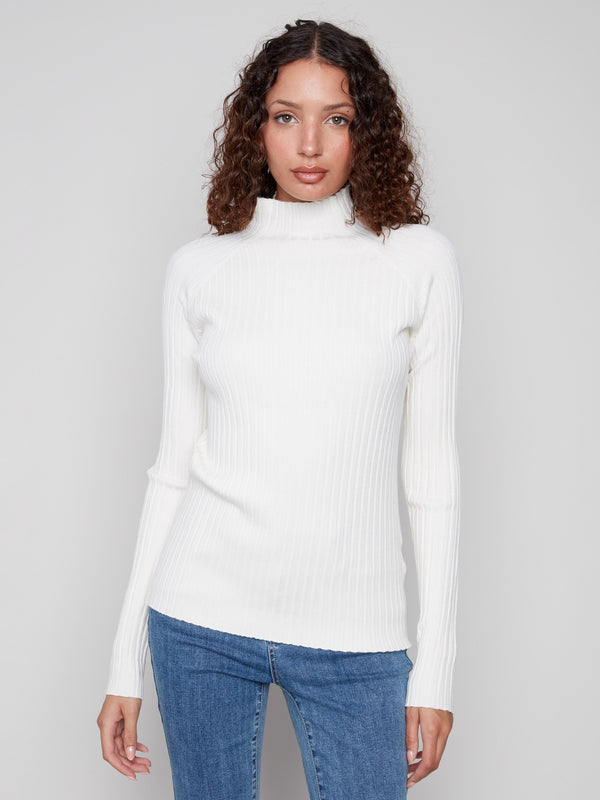 Long sleeves on this ecru sweater provide comfort and elegance by Charlie B.