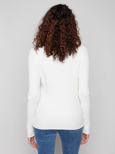 This ecru mock neck sweater offers a timeless look with its ribbed detailing by Charlie B.