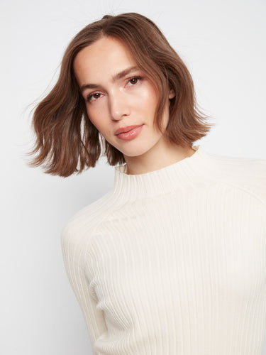 Long sleeves provide warmth while maintaining style in this beautifully crafted sweater. Experience timeless fashion by Charlie B.