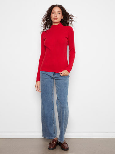 The long sleeves of this sweater provide warmth and elegance, making it a versatile addition to any wardrobe. By Charlie B.
