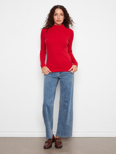 Featuring a chic ribbed knit texture, this red sweater is designed to flatter and enhance your silhouette effortlessly. By Charlie B.