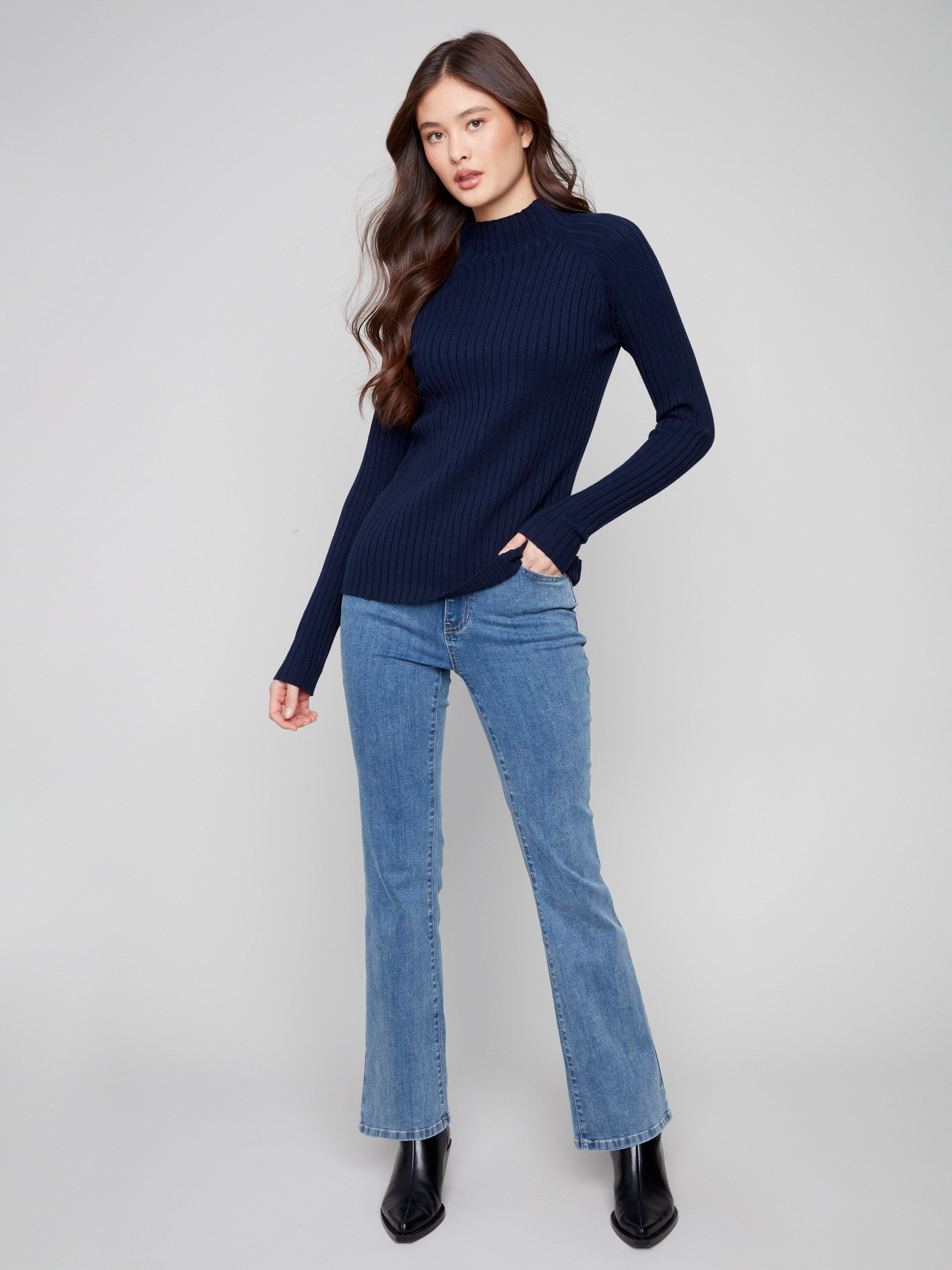 Navy sweater with a slim fit, perfect for layering in cooler weather by Charlie B.