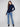 Navy sweater with a slim fit, perfect for layering in cooler weather by Charlie B.