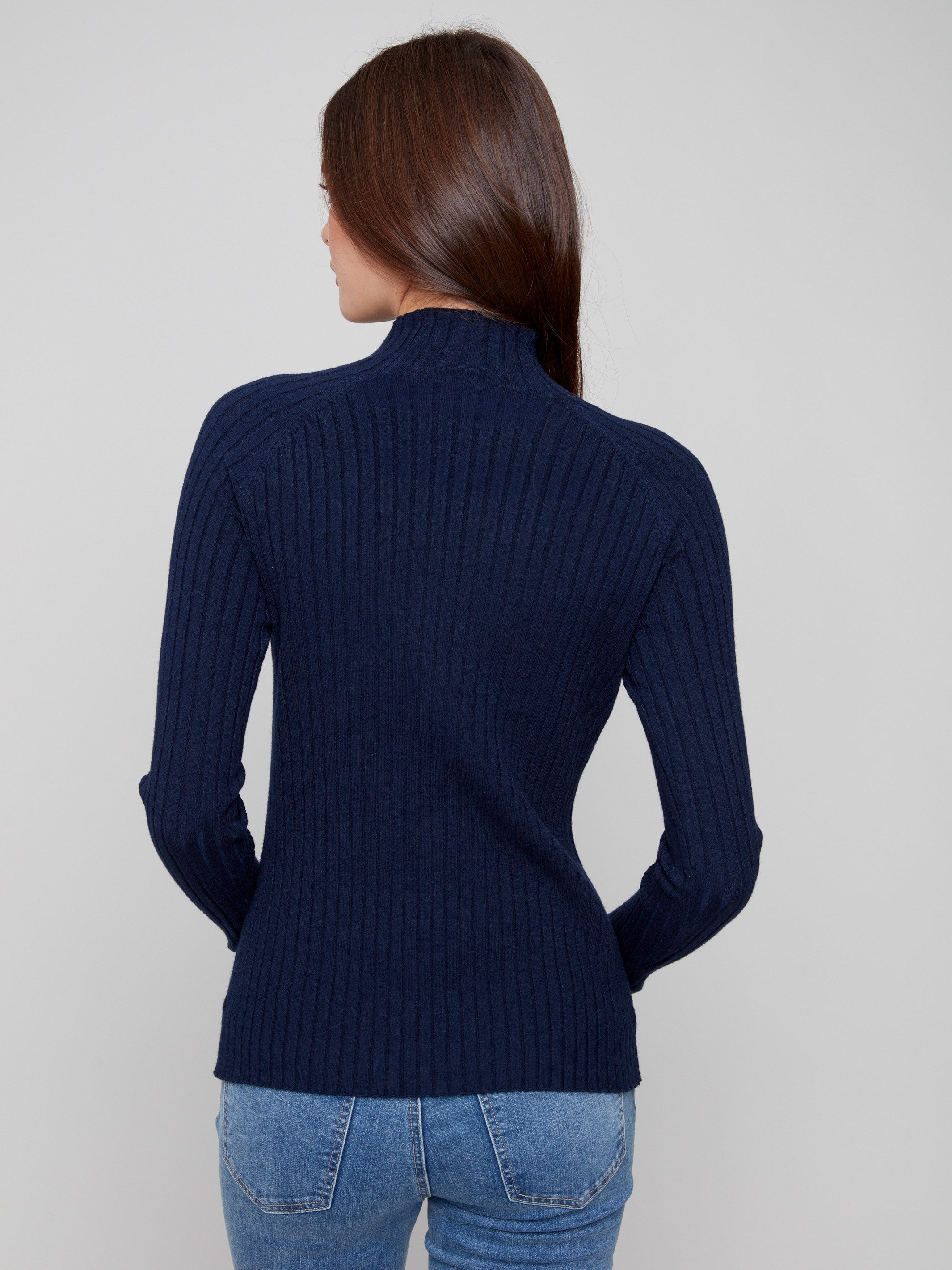 Chic navy sweater offering both warmth and style with its long sleeves by Charlie B.