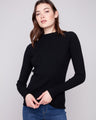 Black ribbed knit sweater featuring a chic mock neck design, perfect for versatile styling by Charlie B.